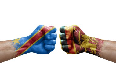 Two hands punch to each others on white background. Country flags painted fists, conflict crisis concept between dr congo and sri lanka
