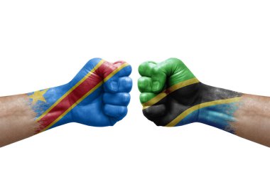 Two hands punch to each others on white background. Country flags painted fists, conflict crisis concept between dr congo and tanzania