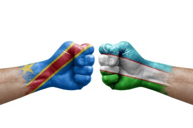 Two hands punch to each others on white background. Country flags painted fists, conflict crisis concept between dr congo and uzbekistan