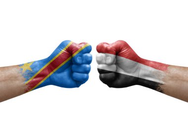 Two hands punch to each others on white background. Country flags painted fists, conflict crisis concept between dr congo and yemen