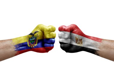 Two hands punch to each others on white background. Country flags painted fists, conflict crisis concept between ecuador and egypt
