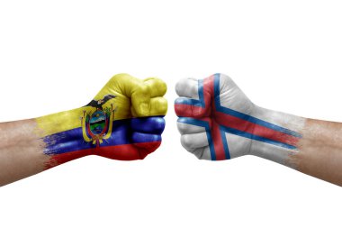 Two hands punch to each others on white background. Country flags painted fists, conflict crisis concept between ecuador and faroe islands