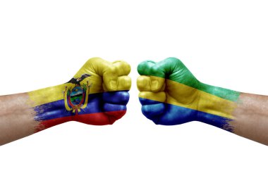 Two hands punch to each others on white background. Country flags painted fists, conflict crisis concept between ecuador and gabon
