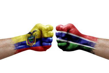 Two hands punch to each others on white background. Country flags painted fists, conflict crisis concept between ecuador and gambia