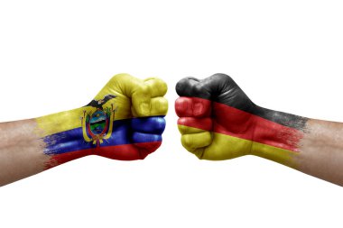 Two hands punch to each others on white background. Country flags painted fists, conflict crisis concept between ecuador and germany