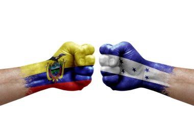 Two hands punch to each others on white background. Country flags painted fists, conflict crisis concept between ecuador and honduras