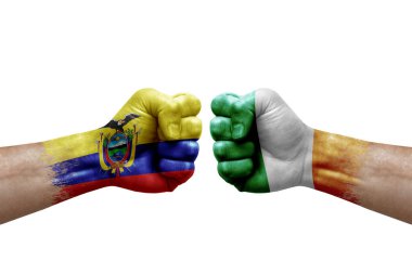 Two hands punch to each others on white background. Country flags painted fists, conflict crisis concept between ecuador and ireland
