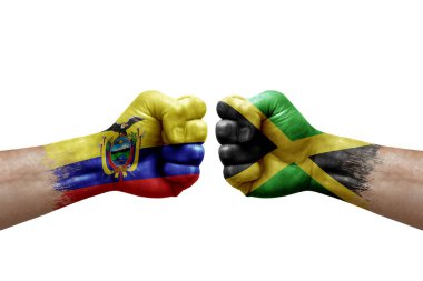 Two hands punch to each others on white background. Country flags painted fists, conflict crisis concept between ecuador and jamaica