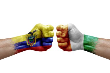 Two hands punch to each others on white background. Country flags painted fists, conflict crisis concept between ecuador and ivory coast