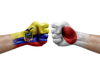 Two hands punch to each others on white background. Country flags painted fists, conflict crisis concept between ecuador and japan