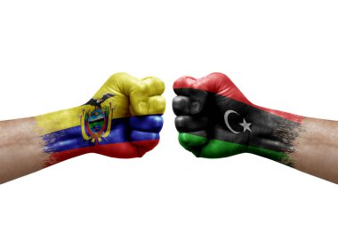 Two hands punch to each others on white background. Country flags painted fists, conflict crisis concept between ecuador and libya