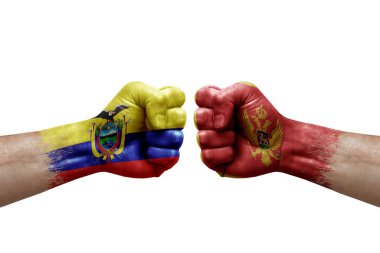 Two hands punch to each others on white background. Country flags painted fists, conflict crisis concept between ecuador and montenegro