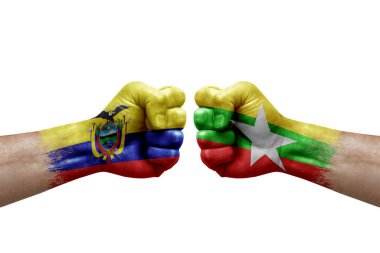Two hands punch to each others on white background. Country flags painted fists, conflict crisis concept between ecuador and myanmar