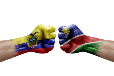Two hands punch to each others on white background. Country flags painted fists, conflict crisis concept between ecuador and namibia