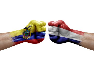 Two hands punch to each others on white background. Country flags painted fists, conflict crisis concept between ecuador and netherlands