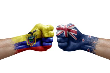 Two hands punch to each others on white background. Country flags painted fists, conflict crisis concept between ecuador and new zealand
