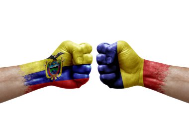 Two hands punch to each others on white background. Country flags painted fists, conflict crisis concept between ecuador and romania