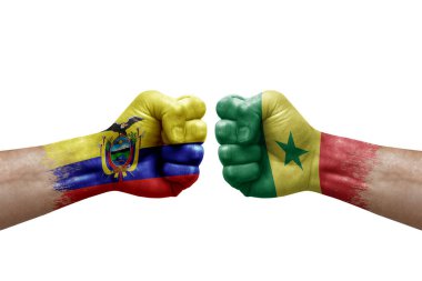 Two hands punch to each others on white background. Country flags painted fists, conflict crisis concept between ecuador and senegal