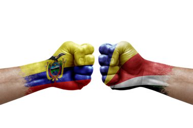 Two hands punch to each others on white background. Country flags painted fists, conflict crisis concept between ecuador and seychelles