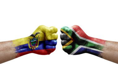 Two hands punch to each others on white background. Country flags painted fists, conflict crisis concept between ecuador and south africa