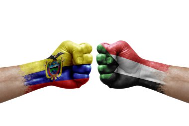 Two hands punch to each others on white background. Country flags painted fists, conflict crisis concept between ecuador and sudan