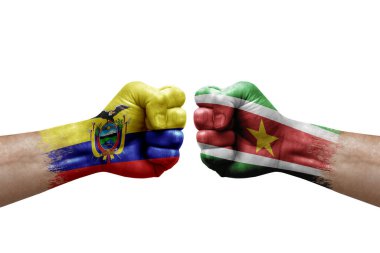 Two hands punch to each others on white background. Country flags painted fists, conflict crisis concept between ecuador and suriname