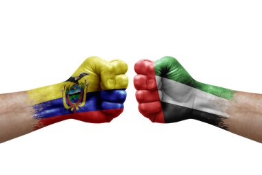Two hands punch to each others on white background. Country flags painted fists, conflict crisis concept between ecuador and united arab emirates