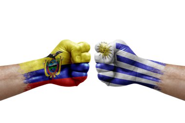 Two hands punch to each others on white background. Country flags painted fists, conflict crisis concept between ecuador and uruguay
