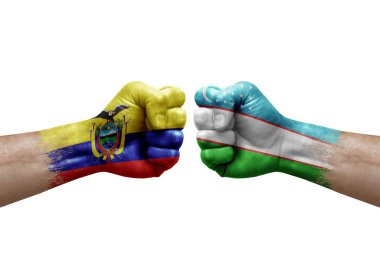 Two hands punch to each others on white background. Country flags painted fists, conflict crisis concept between ecuador and uzbekistan