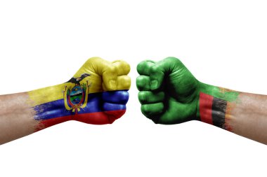 Two hands punch to each others on white background. Country flags painted fists, conflict crisis concept between ecuador and zambia
