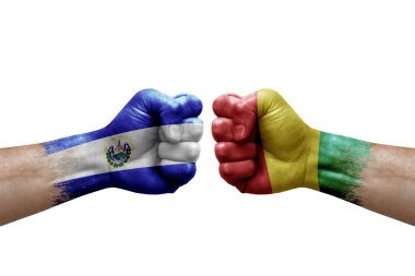 Two hands punch to each others on white background. Country flags painted fists, conflict crisis concept between el salvador and guinea