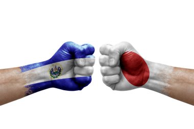 Two hands punch to each others on white background. Country flags painted fists, conflict crisis concept between el salvador and japan
