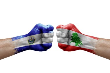 Two hands punch to each others on white background. Country flags painted fists, conflict crisis concept between el salvador and lebanon