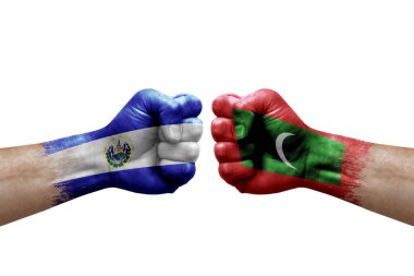Two hands punch to each others on white background. Country flags painted fists, conflict crisis concept between el salvador and maldives