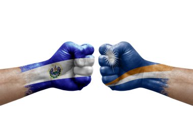 Two hands punch to each others on white background. Country flags painted fists, conflict crisis concept between el salvador and marshall islands