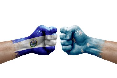 Two hands punch to each others on white background. Country flags painted fists, conflict crisis concept between el salvador and micronesia