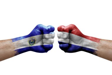 Two hands punch to each others on white background. Country flags painted fists, conflict crisis concept between el salvador and netherlands