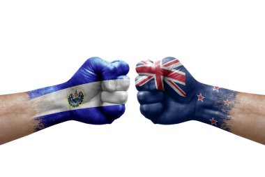 Two hands punch to each others on white background. Country flags painted fists, conflict crisis concept between el salvador and new zealand