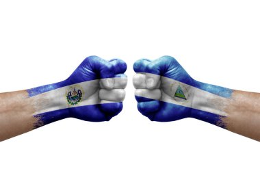 Two hands punch to each others on white background. Country flags painted fists, conflict crisis concept between el salvador and nicaragua