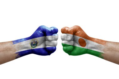 Two hands punch to each others on white background. Country flags painted fists, conflict crisis concept between el salvador and niger