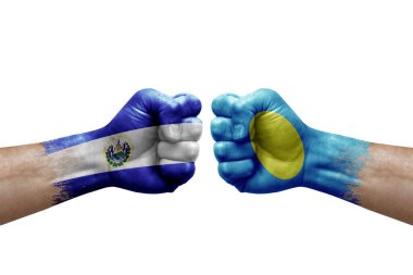 Two hands punch to each others on white background. Country flags painted fists, conflict crisis concept between el salvador and palau