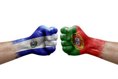 Two hands punch to each others on white background. Country flags painted fists, conflict crisis concept between el salvador and portugal
