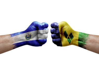 Two hands punch to each others on white background. Country flags painted fists, conflict crisis concept between el salvador and saint vincent and the grenadines