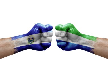 Two hands punch to each others on white background. Country flags painted fists, conflict crisis concept between el salvador and sierra leone
