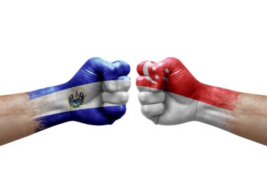 Two hands punch to each others on white background. Country flags painted fists, conflict crisis concept between el salvador and singapore
