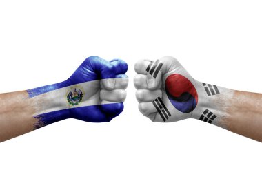 Two hands punch to each others on white background. Country flags painted fists, conflict crisis concept between el salvador and south korea