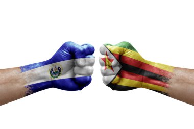 Two hands punch to each others on white background. Country flags painted fists, conflict crisis concept between el salvador and zimbabwe