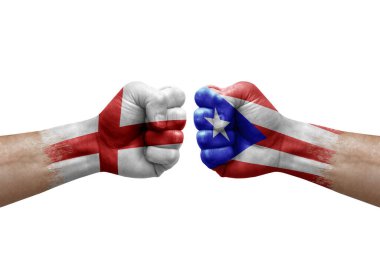 Two hands punch to each others on white background. Country flags painted fists, conflict crisis concept between england and puerto rico