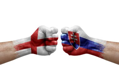 Two hands punch to each others on white background. Country flags painted fists, conflict crisis concept between england and slovakia