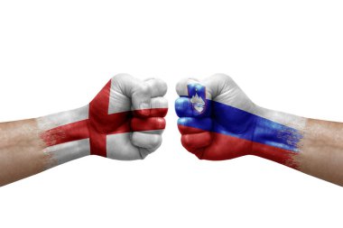 Two hands punch to each others on white background. Country flags painted fists, conflict crisis concept between england and slovenia